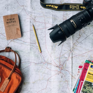 Travel planning map and camera — why use a travel agent Beyond Holidays NZ